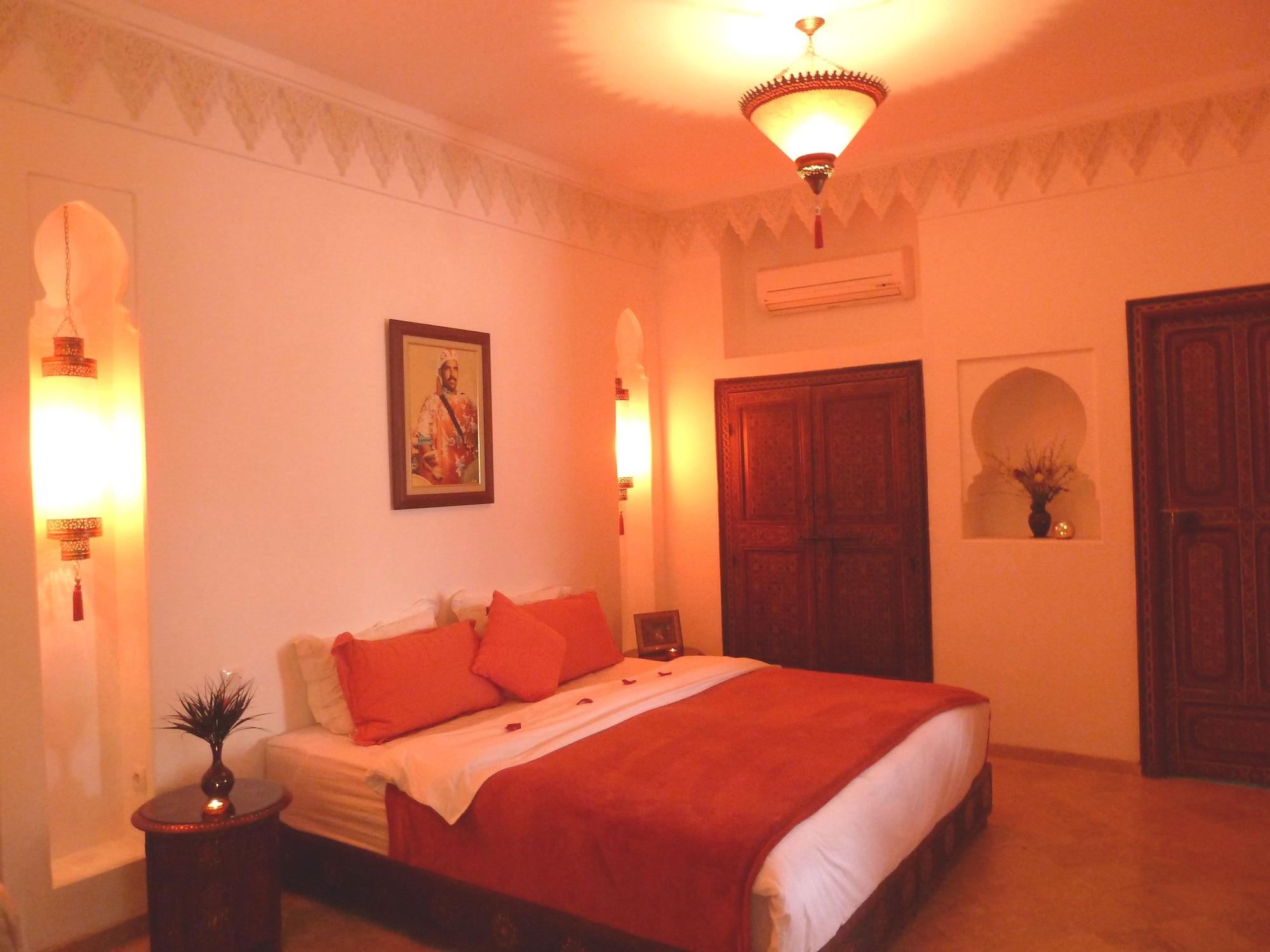 Riad Viva Marraquexe Exterior foto A bedroom in a hotel in Morocco