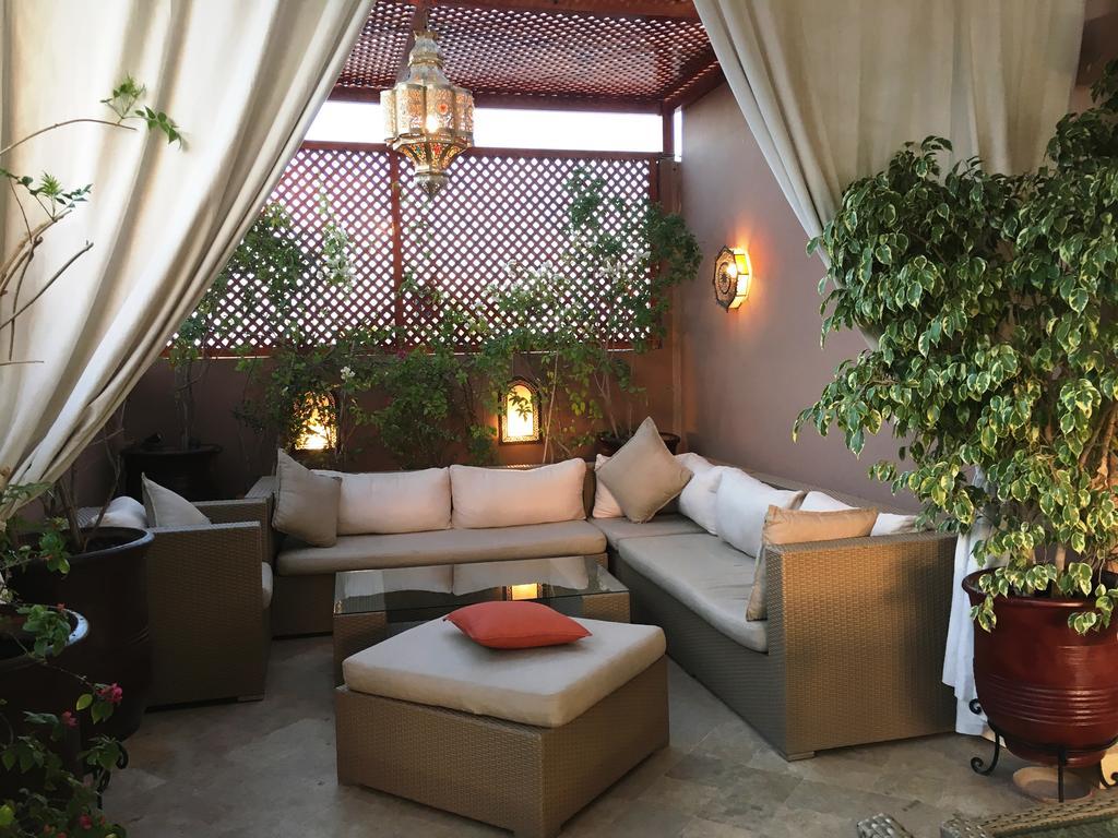 Riad Viva Marraquexe Exterior foto A Moroccan patio